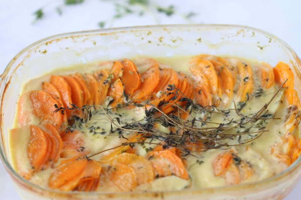 creamy sweet potato baked in a pan with thyme