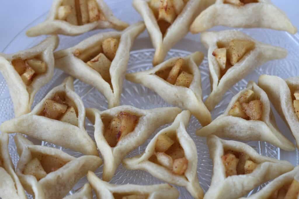 apple pie hamantaschen cookies on a plate