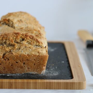 Beer bread loaf on a cutting board