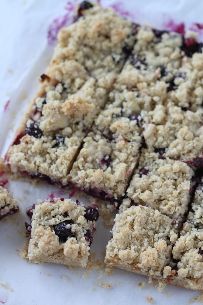 cut Blueberry Oatmeal Bars on a baking paper