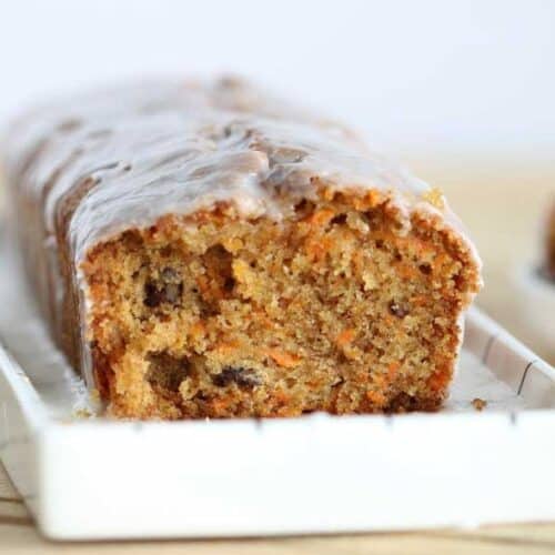 cut carrot cake loaf on a platter