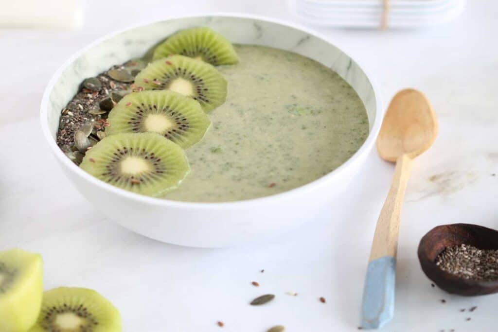 Green Smoothie Bowl garnished with kiwi and seeds