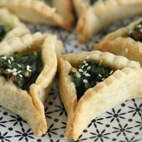 Spinach Hamantaschen cookies on a plate
