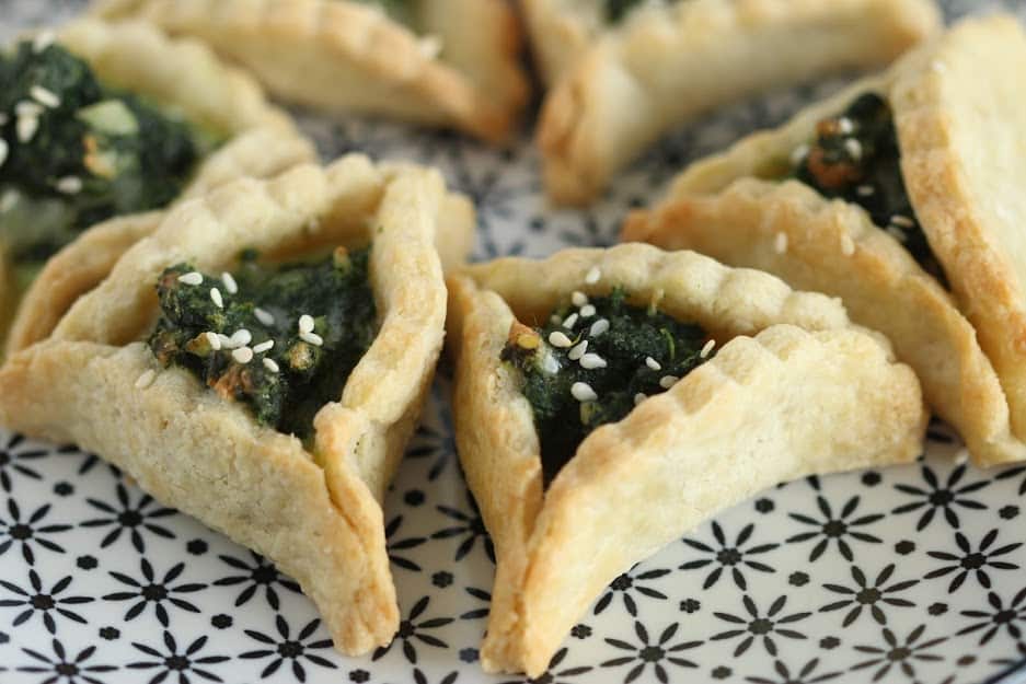 Spinach Hamantaschen cookies on a plate