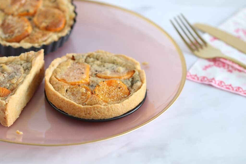 Sweet Potato Tartlets (Mini Quiches) on a pink plate