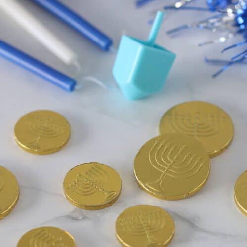 Hanukkah candles, dreidels and gelt chocolate coins