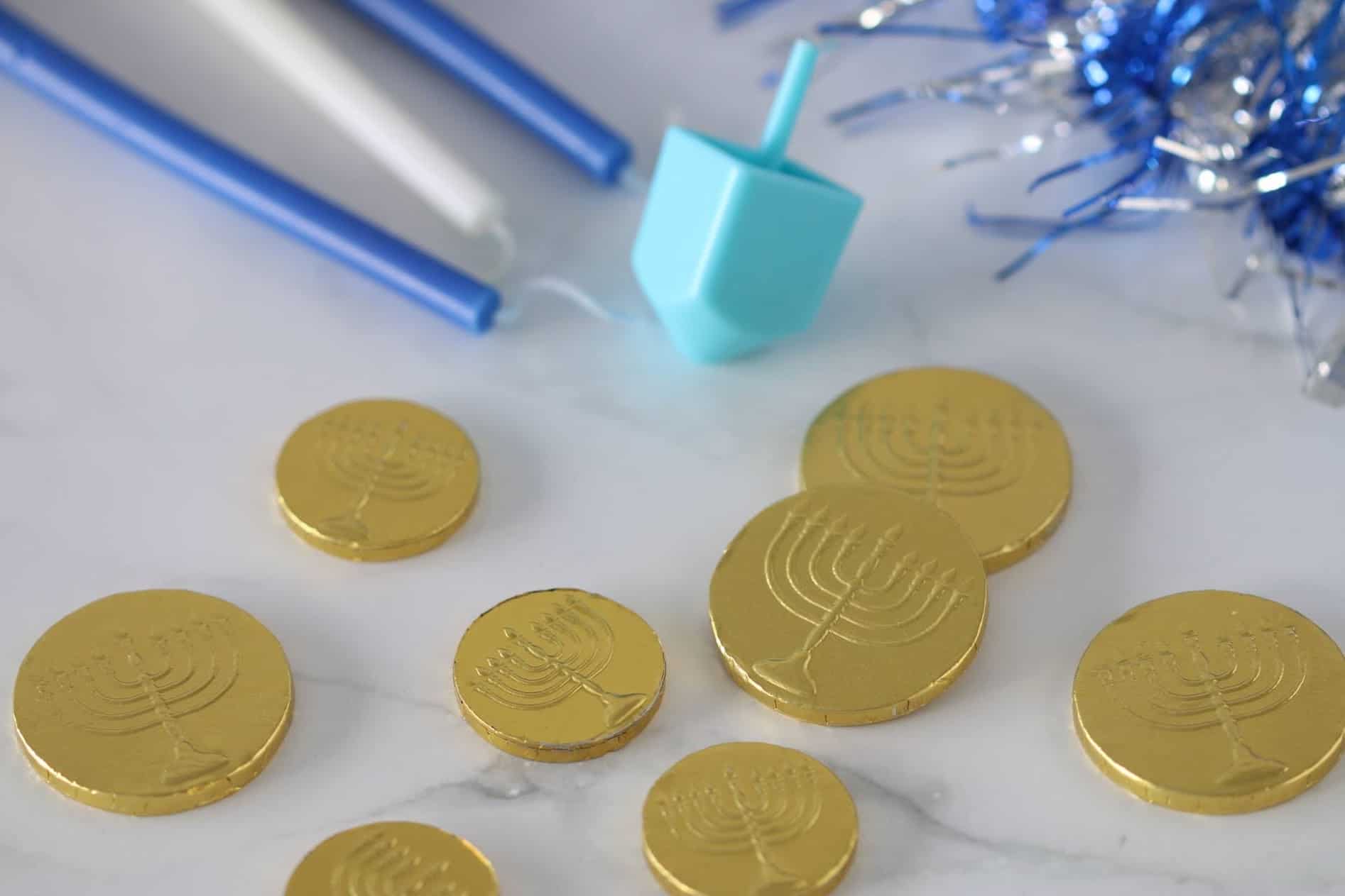Hanukkah candles, dreidels and gelt chocolate coins