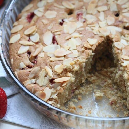 gluten free strawberry almond cake cut in a baking pan