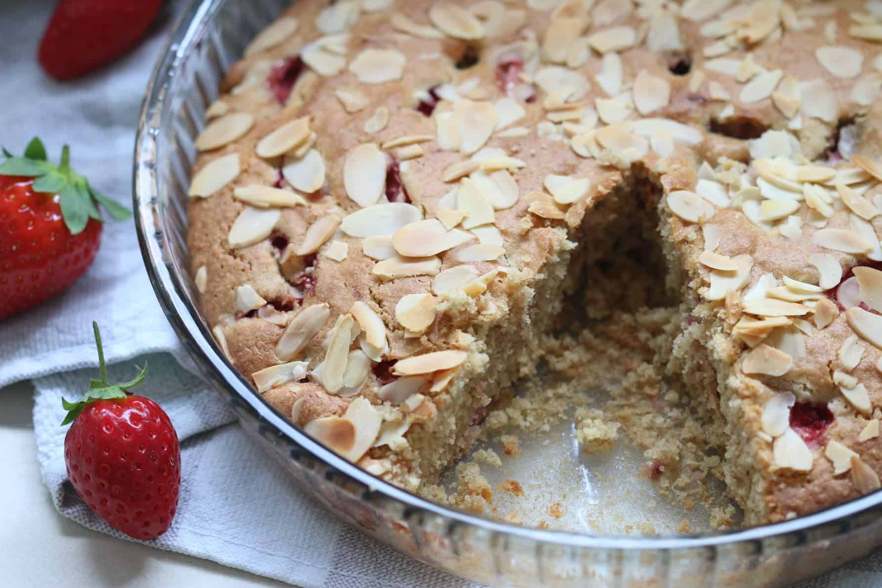 gluten free strawberry almond cake cut in a baking pan