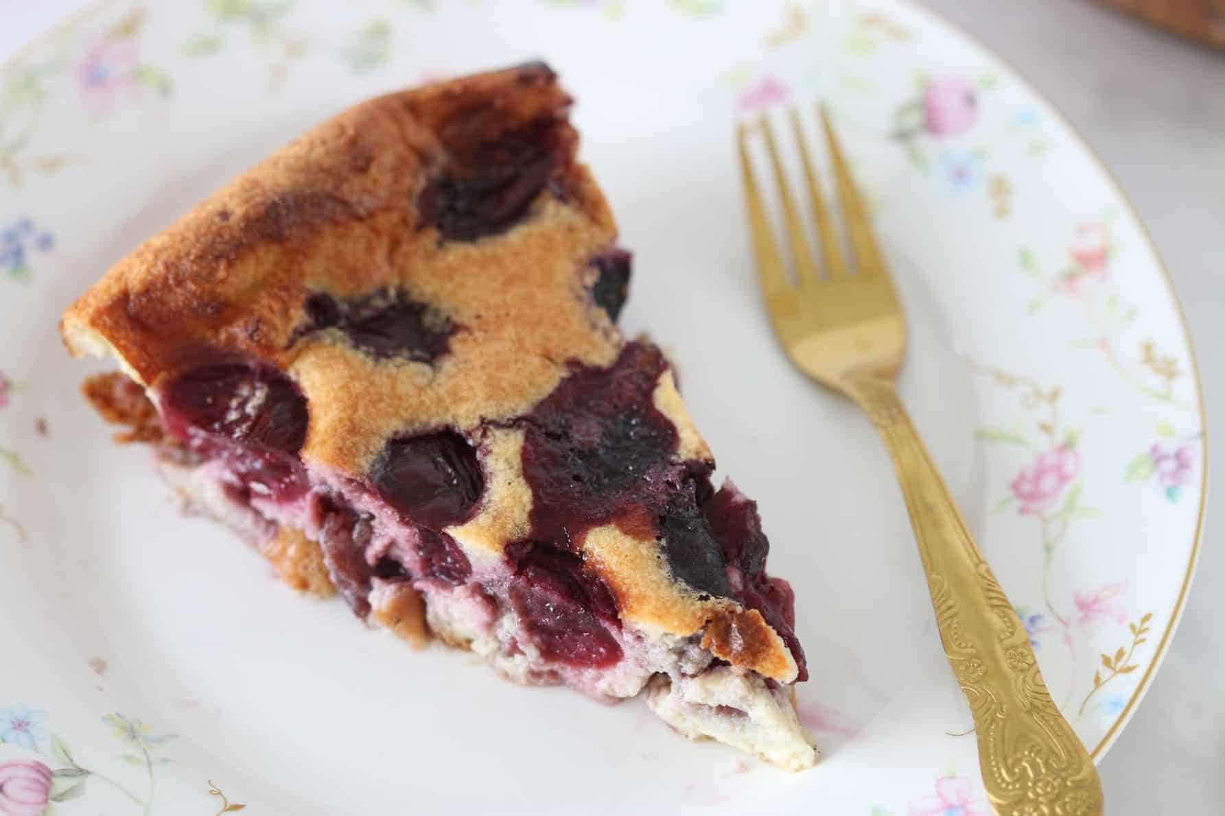 cherry clafoutis slice on a plate