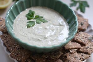 green tahini dip in a bowl